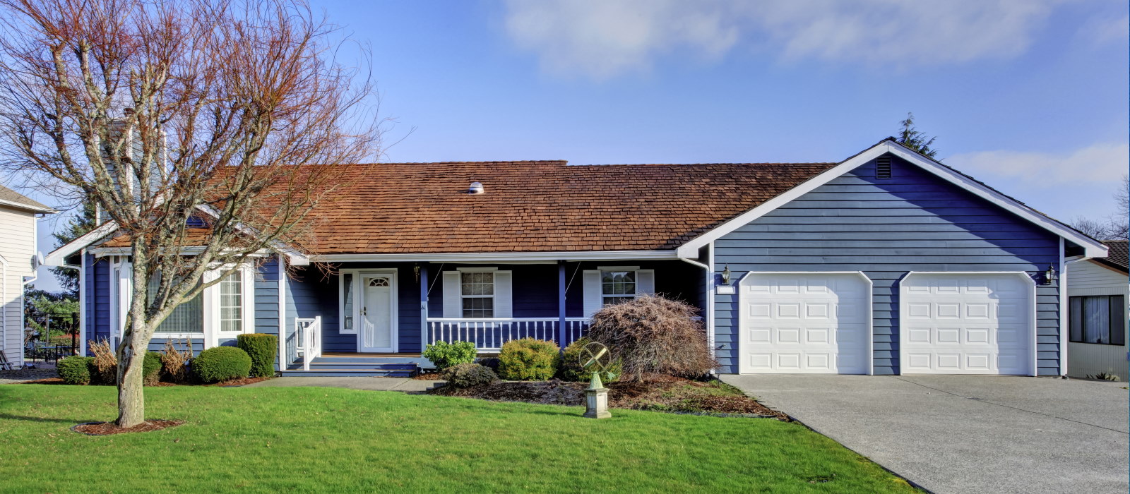 Couple sitting together on couch looking at laptop